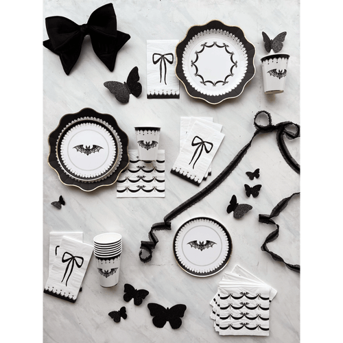 Black and white Halloween plates cups napkins and butterfly table decorations from Parte Haus party supply store in Bethesda MD