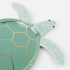 Green turtle shaped plate with gold accents for ocean theme from Parte Haus party supply store in Bethesda MD