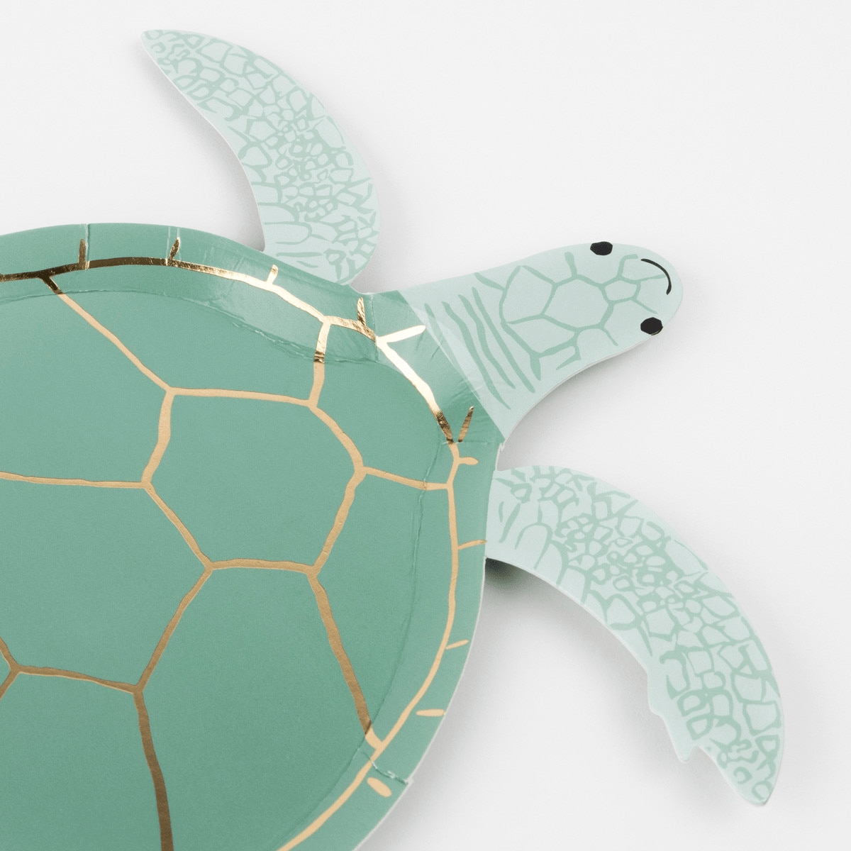 Green turtle shaped plate with gold accents for ocean theme from Parte Haus party supply store in Bethesda MD