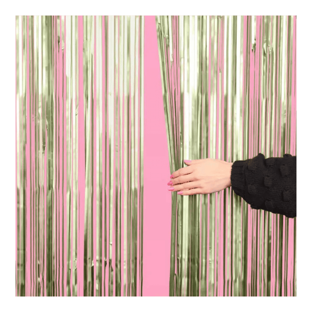 Pink and metallic gold fringe curtain backdrop for celebration theme from Parte Haus party supply store in Bethesda MD