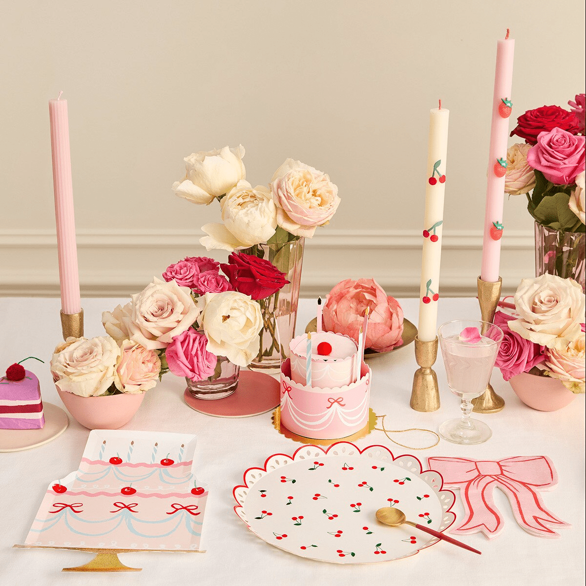 Pink cherry birthday tableware with cake-shaped plates and floral decor birthday theme from Parte Haus party supply store in Bethesda Maryland