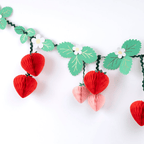 Red and pink strawberry garland with green leaves and white flowers spring theme from Parte Haus party supply store in Bethesda MD