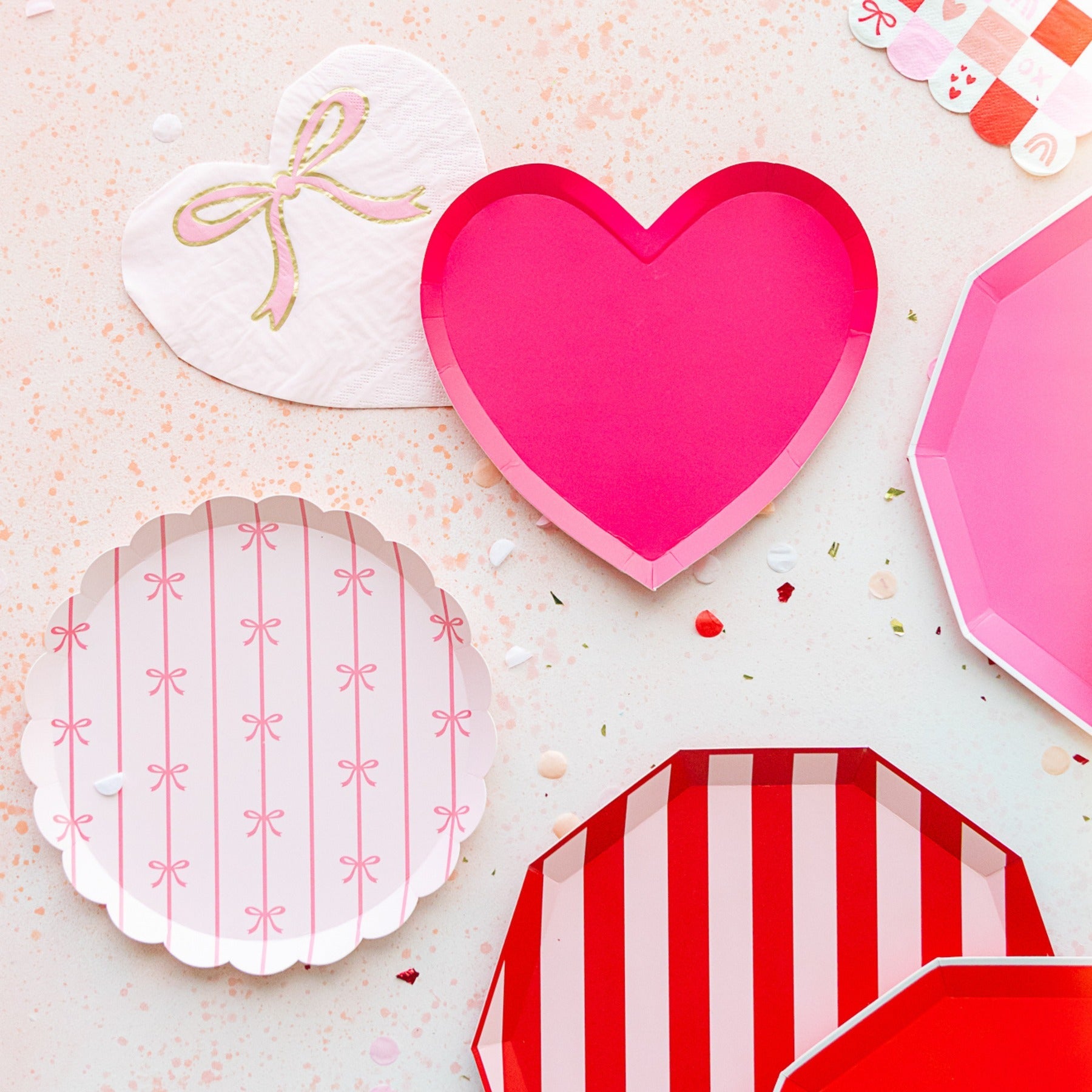 Pink heart plate and pastel paper plates for Valentine's Day from Parte Haus party supply store in Bethesda Maryland