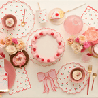 Pink cherry theme tableware with scalloped plates cake and flowers birthday celebration from Parte Haus party supply store in Bethesda Maryland.