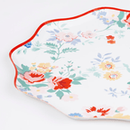 Multicolor floral plate with scalloped edge for spring garden theme from Parte Haus party supply store in Bethesda MD.