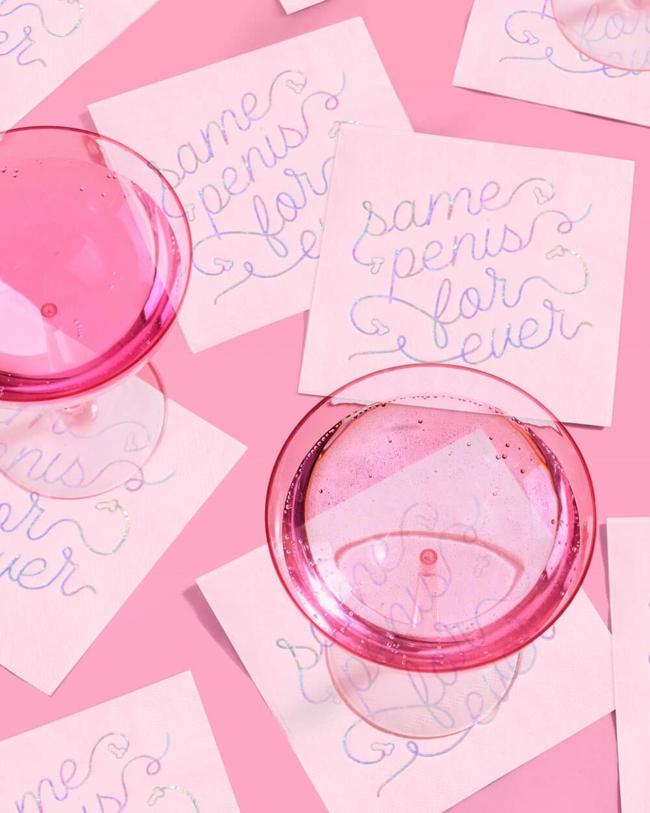 Pink bachelorette napkins with glitter script and pink cocktail glasses from Parte Haus party supply store in Bethesda Maryland