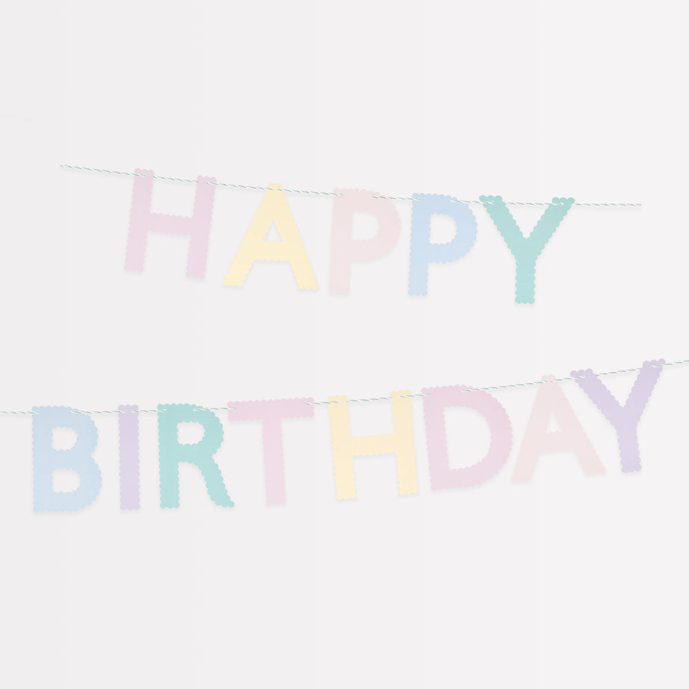 Pastel color happy birthday banner with scalloped letters for birthday from Parte Haus party supply store in Bethesda MD.