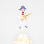 White blue clown cake topper with guitar circus theme from Parte Haus party supply store in Bethesda Maryland.