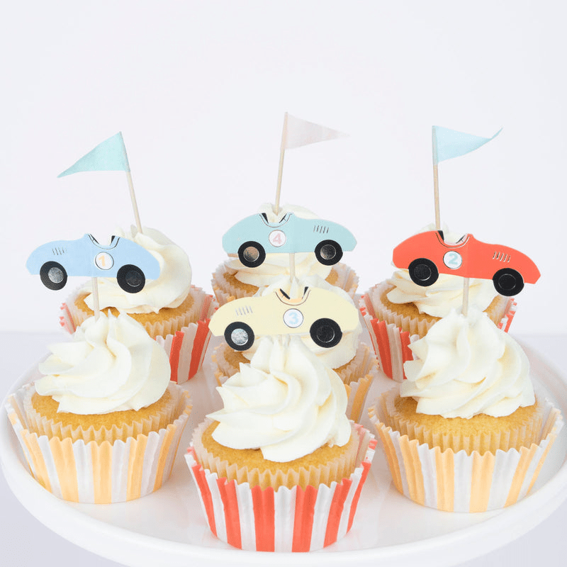 Multicolor race car cupcake toppers on vanilla cupcakes birthday theme from Parte Haus party supply store in Bethesda Maryland