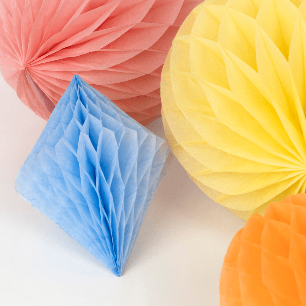 Pastel pink yellow blue and orange honeycomb decorations for birthday from Parte Haus party supply store in Bethesda MD.