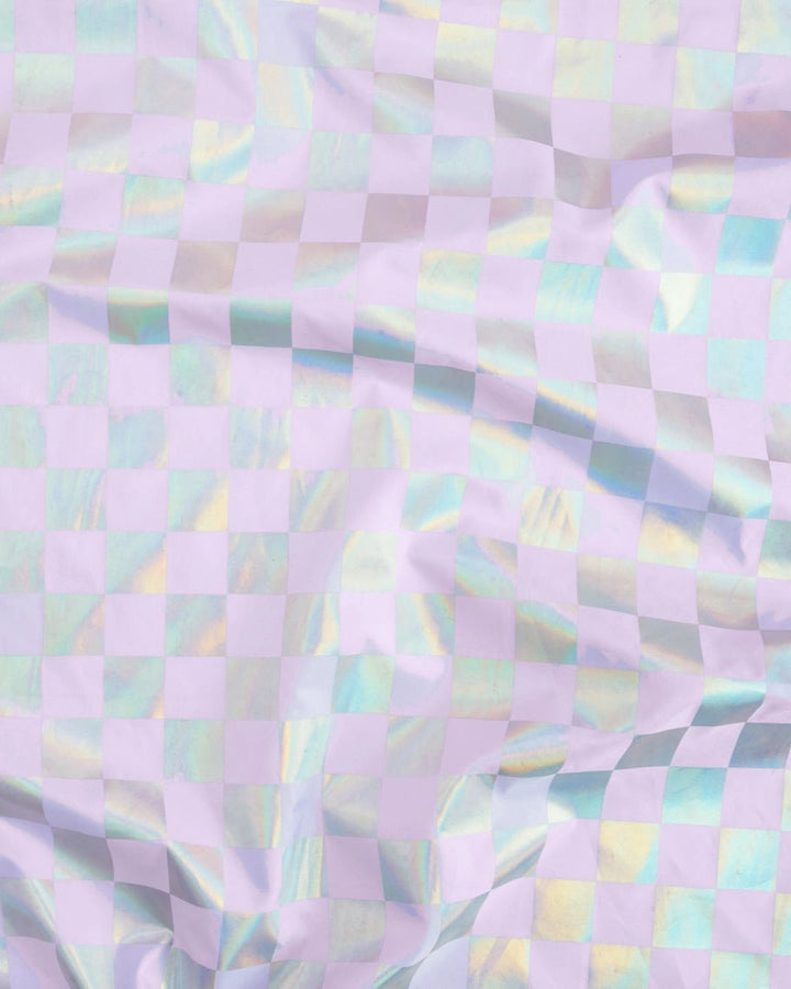 Iridescent pastel checkered table cover for birthday from Parte Haus party supply store in Bethesda Maryland