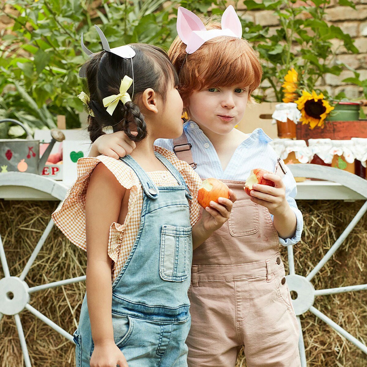 Multicolor farm animal headbands and kids wearing overalls at farm birthday theme from Parte Haus party supply store in Bethesda Maryland