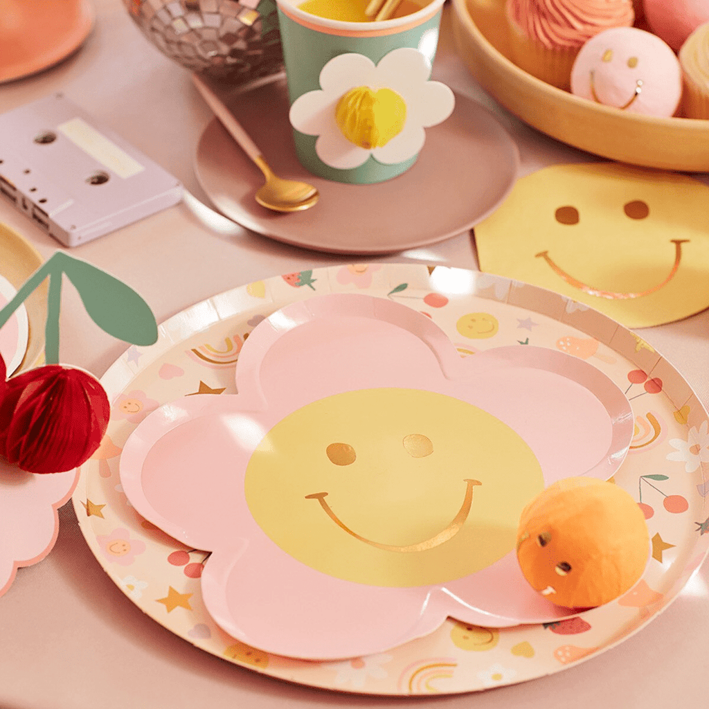 Pink flower-shaped smiley plate birthday table decor from Parte Haus party supply store in Bethesda Maryland