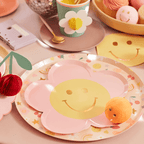 Pink flower-shaped smiley plate birthday table decor from Parte Haus party supply store in Bethesda Maryland