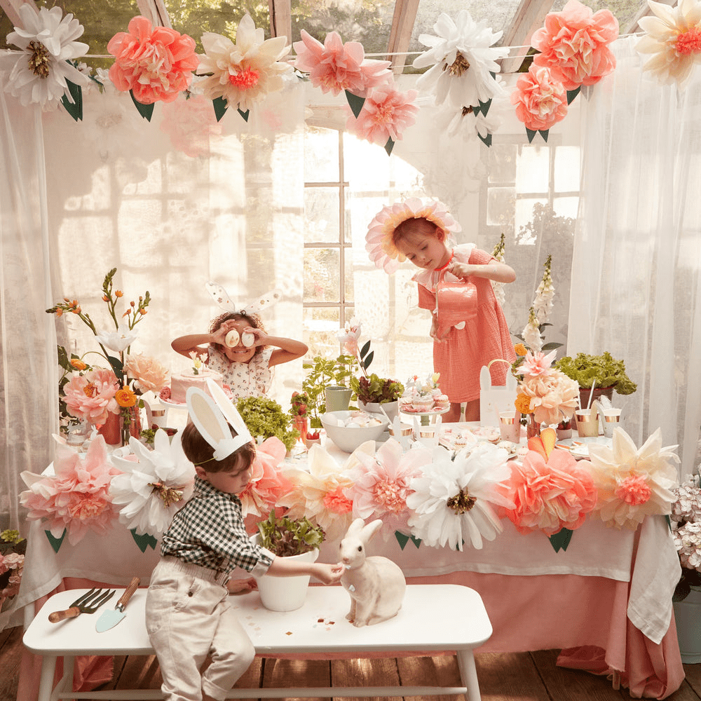 Peach and white floral kids table decor with bunny props Easter theme from Parte Haus party supply store in Bethesda MD