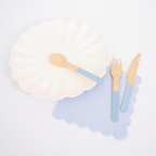 Blue and white tableware set with scalloped plate and wooden cutlery birthday from Parte Haus party supply store in Bethesda Maryland.