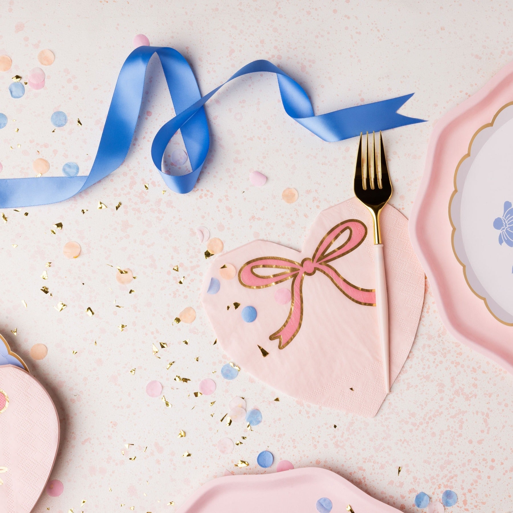 Pink heart napkin with gold bow for birthday celebration from Parte Haus party supply store in Bethesda Maryland