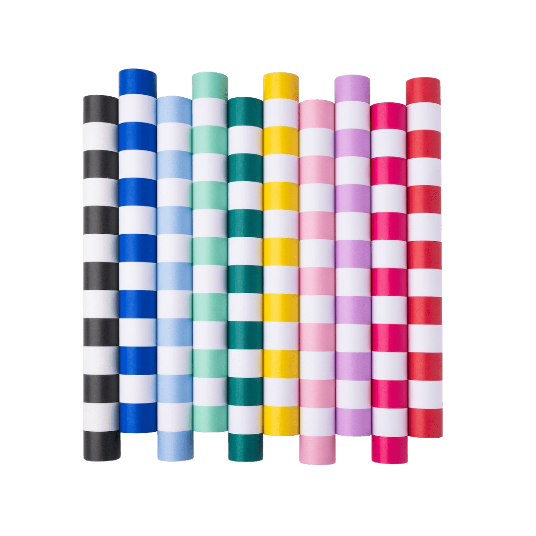 Multicolor striped paper straws arranged in a row birthday theme from Parte Haus party supply store in Bethesda MD.