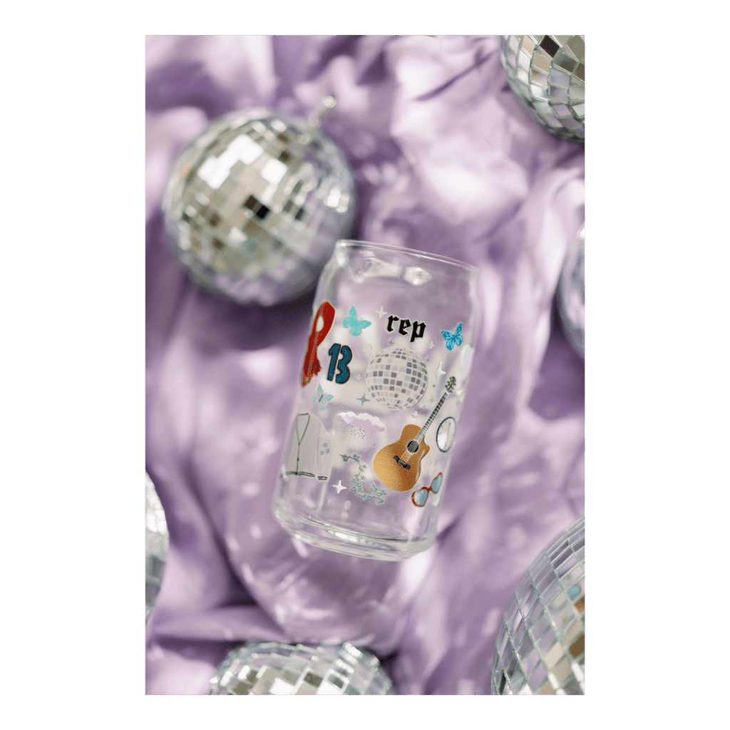 Clear Taylor Swift themed glass can with colorful designs for birthday celebration from Parte Haus party supply store in Bethesda MD