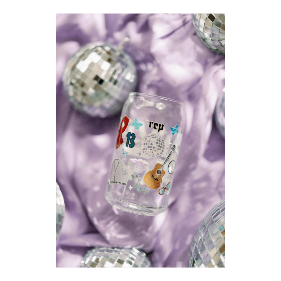 Clear Taylor Swift themed glass can with colorful designs for birthday celebration from Parte Haus party supply store in Bethesda MD