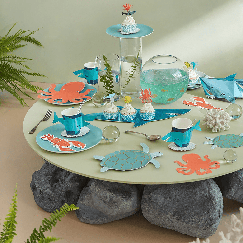 Aqua and orange sea animal plates and cups under the sea birthday theme from Parte Haus party supply store in Bethesda, Maryland