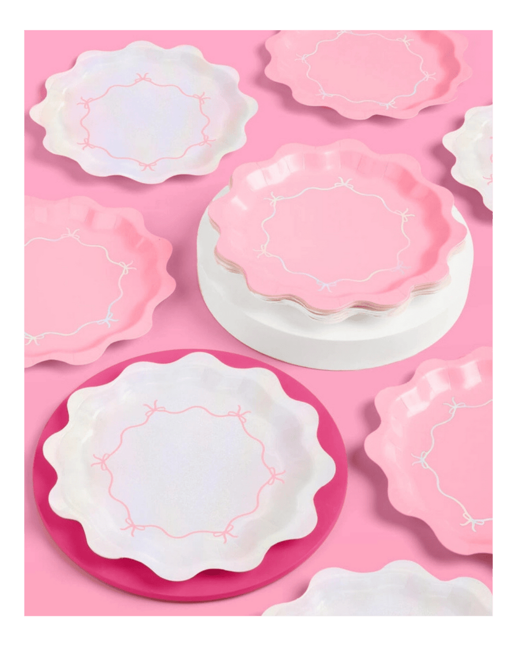 Pink and iridescent scalloped paper plates with bow designs birthday theme from Parte Haus party supply store in Bethesda MD