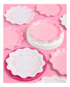 Pink and iridescent scalloped paper plates with bow designs birthday theme from Parte Haus party supply store in Bethesda MD