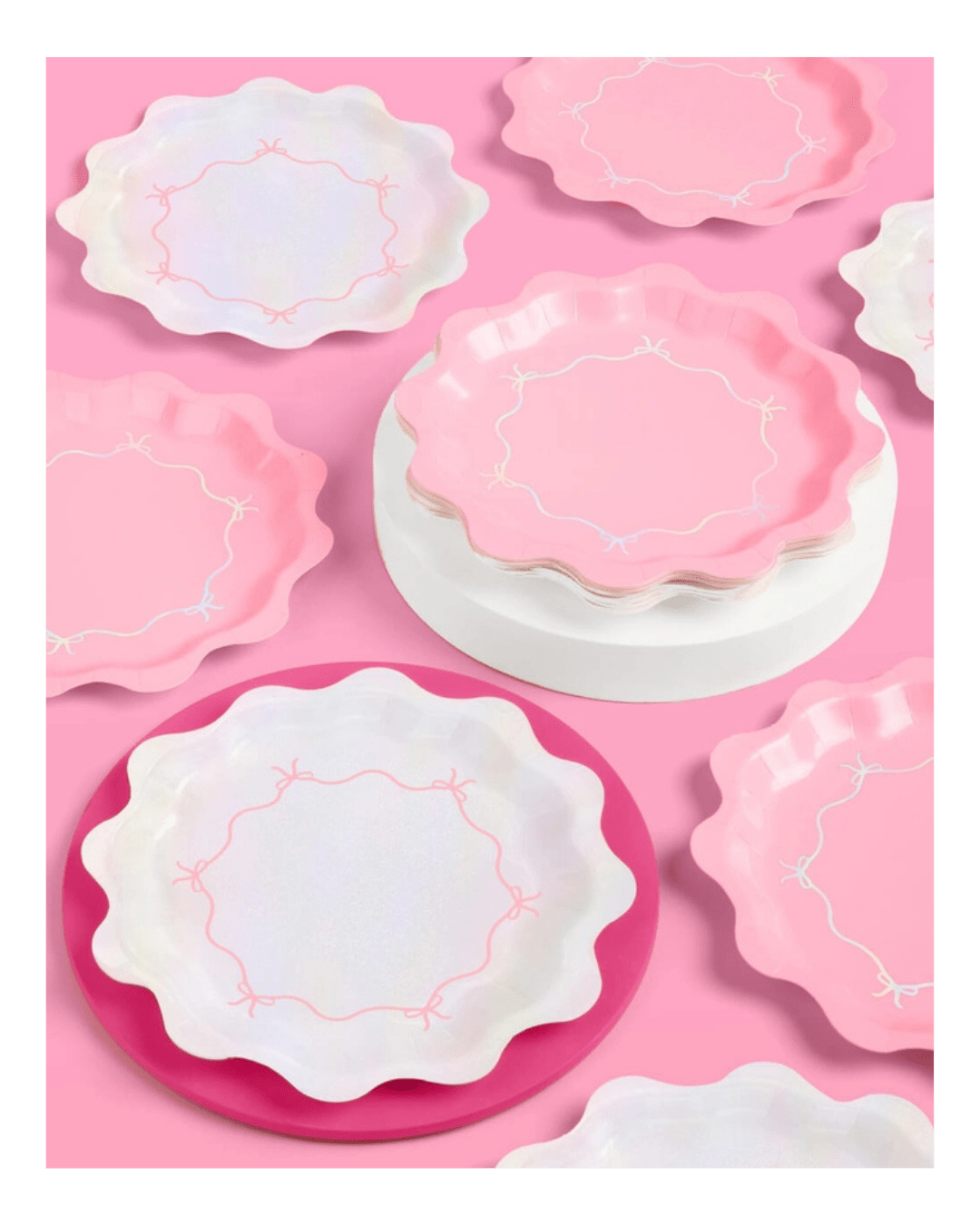 Pink and iridescent scalloped paper plates with bow designs birthday theme from Parte Haus party supply store in Bethesda MD