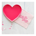 Pink heart plate and Let’s Go Party napkin for celebration theme from Parte Haus party supply store in Bethesda MD