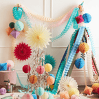 Multicolor paper decorations garland and hanging fans for birthday from Parte Haus party supply store in Bethesda MD