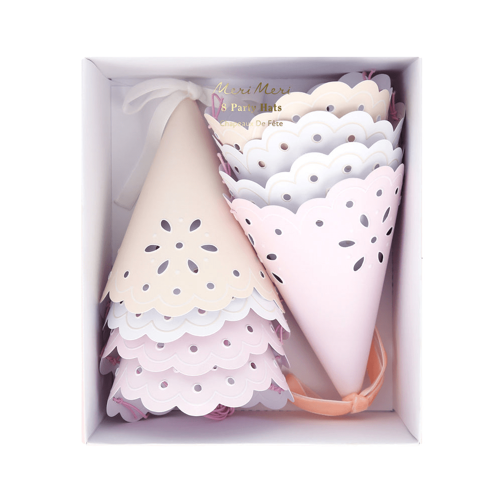 Pastel pink and cream party hats with scalloped edges for birthday from Parte Haus party supply store in Bethesda Maryland