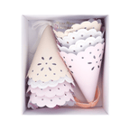 Pastel pink and cream party hats with scalloped edges for birthday from Parte Haus party supply store in Bethesda Maryland