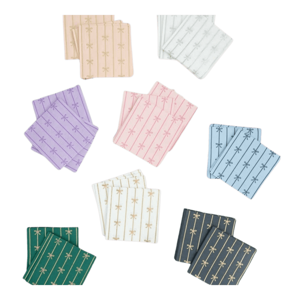Pastel and dark assorted cocktail napkins with gold bow patterns celebration theme from Parte Haus party supply store in Bethesda MD