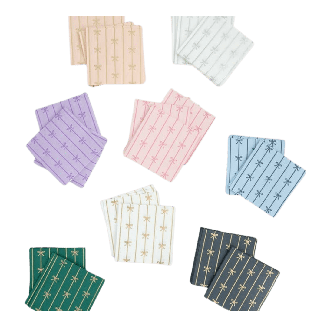 Pastel and dark assorted cocktail napkins with gold bow patterns celebration theme from Parte Haus party supply store in Bethesda MD