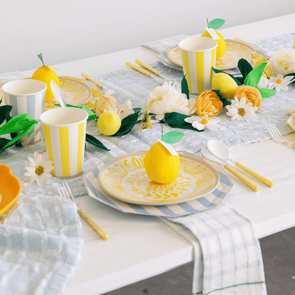 Yellow striped tableware and lemon themed place setting summer tablescape at Parte Haus party supply store in Bethesda Maryland