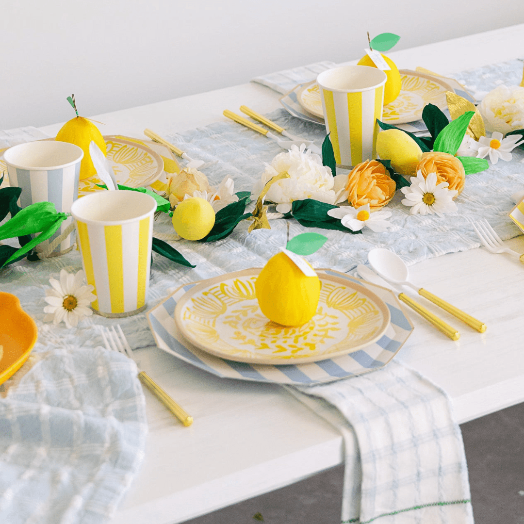 Yellow striped tableware and lemon themed place setting summer tablescape at Parte Haus party supply store in Bethesda Maryland