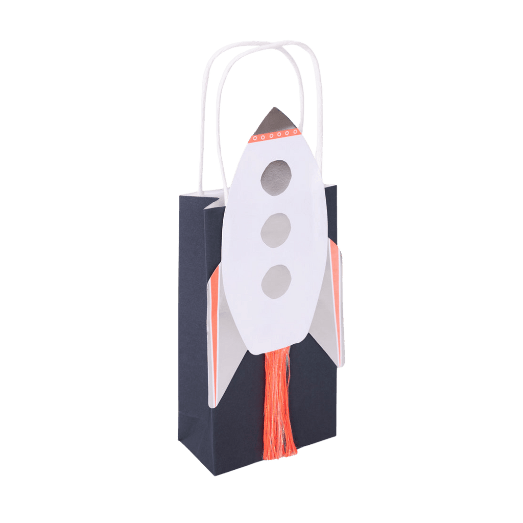 Navy blue rocket gift bag with white handles space theme from Parte Haus party supply store in Bethesda Maryland
