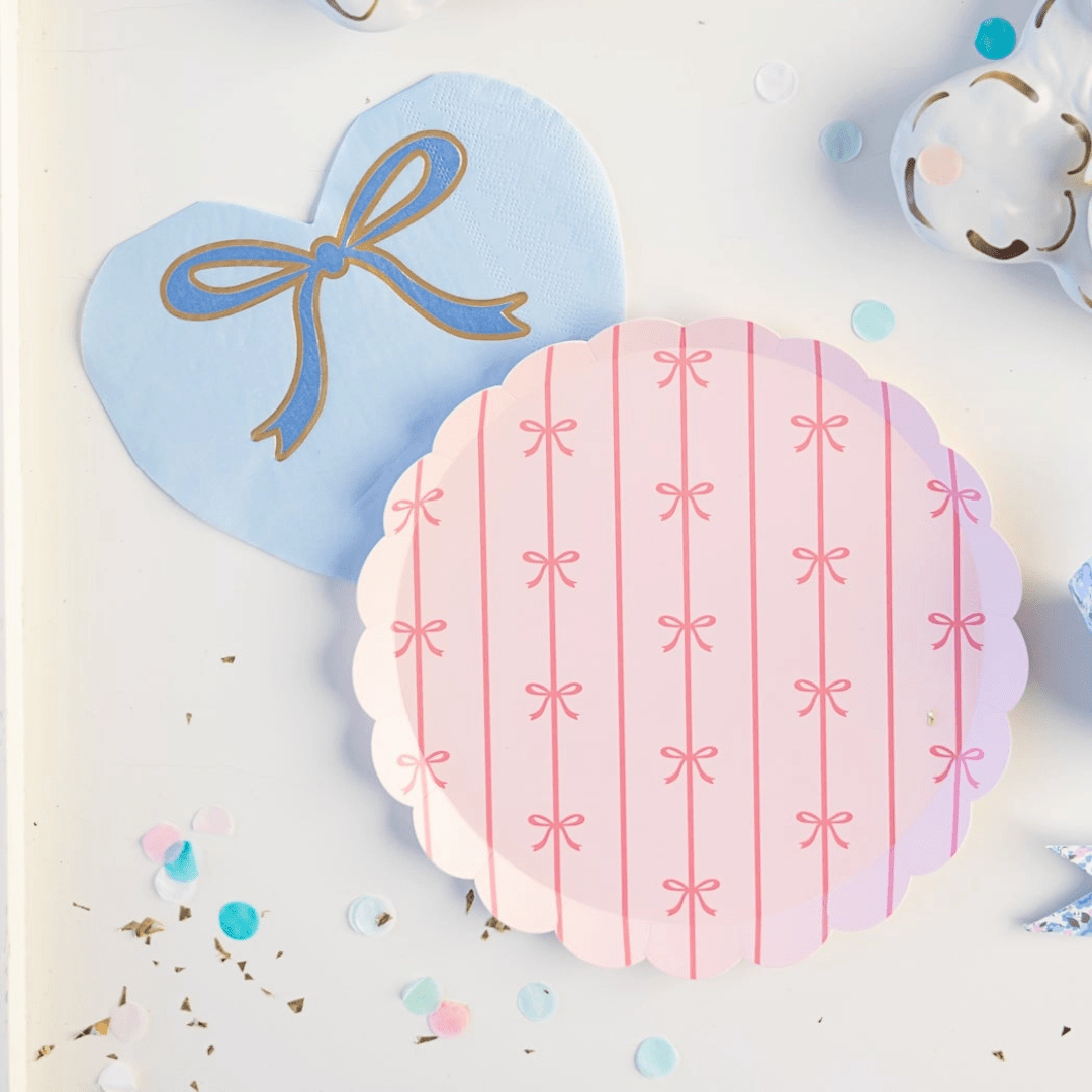 Pink and blue bow paper plates with confetti baby shower theme from Parte Haus party supply store in Bethesda Maryland