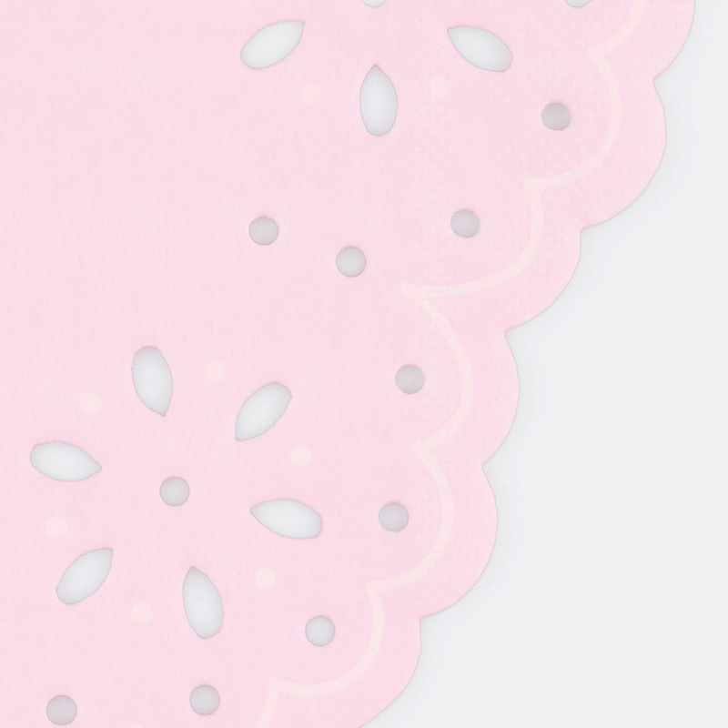Pink paper doily with scalloped edge and floral cutouts for birthdays from Parte Haus party supply store in Bethesda MD