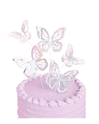 Iridescent butterfly cake toppers on pastel pink cake birthday theme from Parte Haus party supply store in Bethesda MD