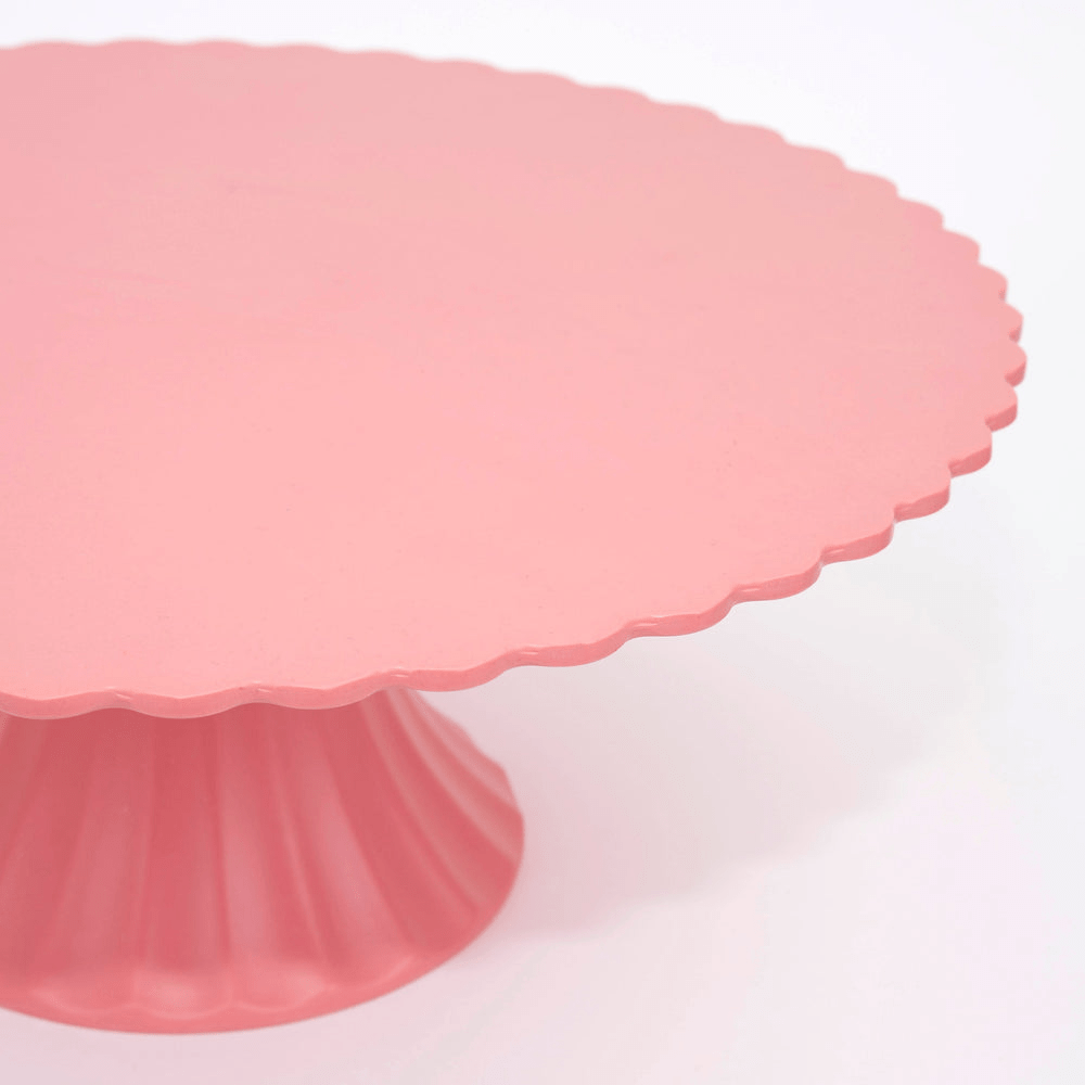 Pink cake stand with scalloped edge for celebrations from Parte Haus party supply store in Bethesda MD.