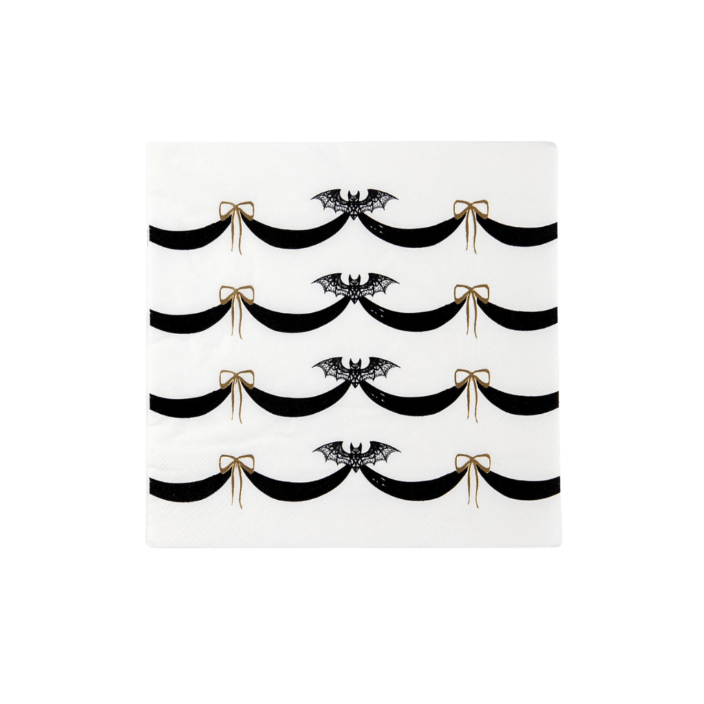 Black and white Halloween napkin with bats and gold bows from Parte Haus party supply store in Bethesda Maryland