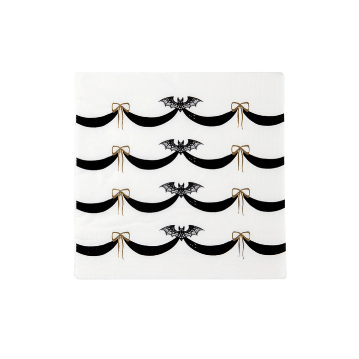 Black and white Halloween napkin with bats and gold bows from Parte Haus party supply store in Bethesda Maryland
