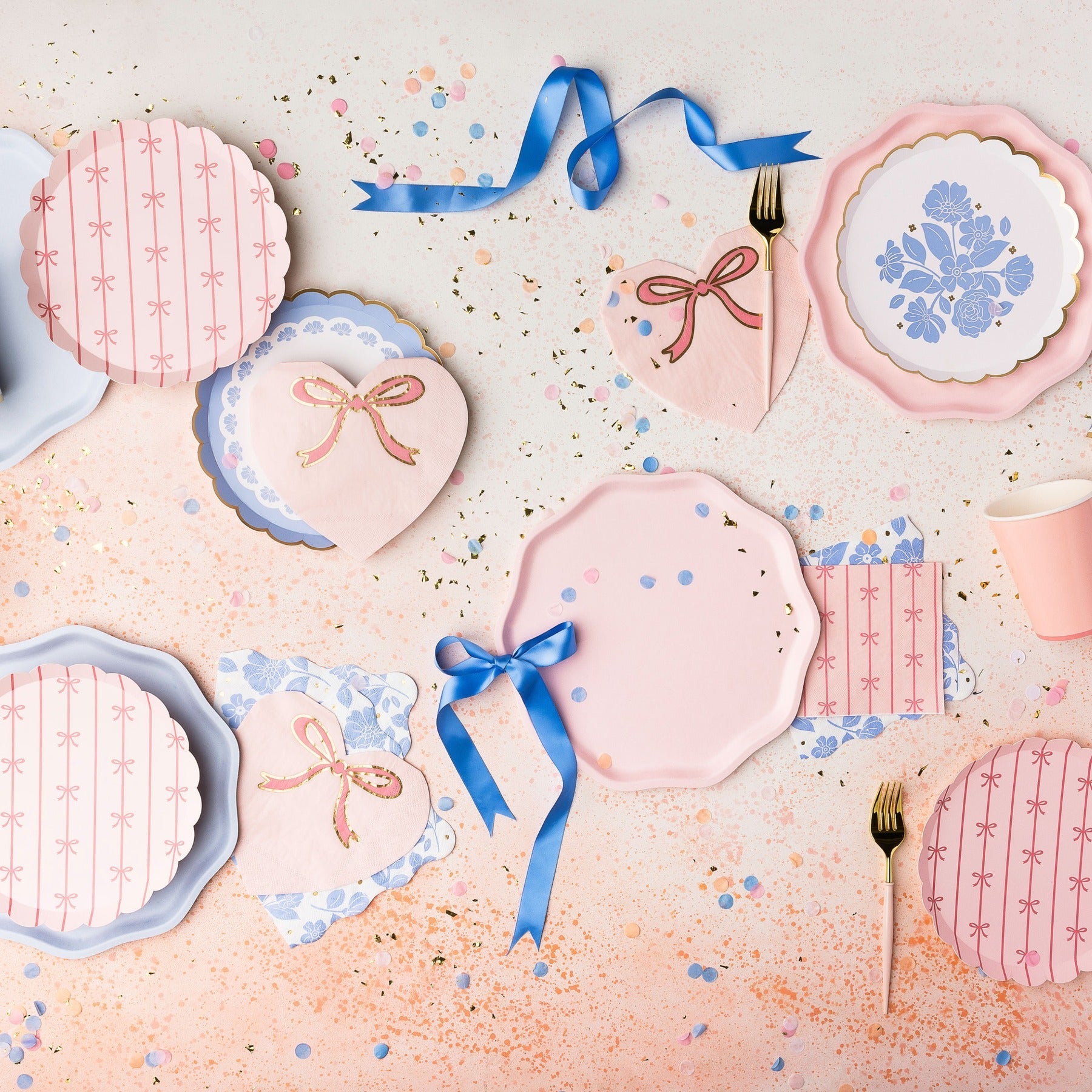 Pink and blue party plates with heart and bow designs birthday theme from Parte Haus party supply store in Bethesda MD