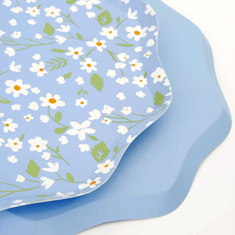 Blue floral scalloped plates featuring white daisy pattern spring theme from Parte Haus party supply store in Bethesda Maryland