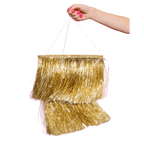Gold fringe piñata with pink string for celebration from Parte Haus party supply store in Bethesda Maryland