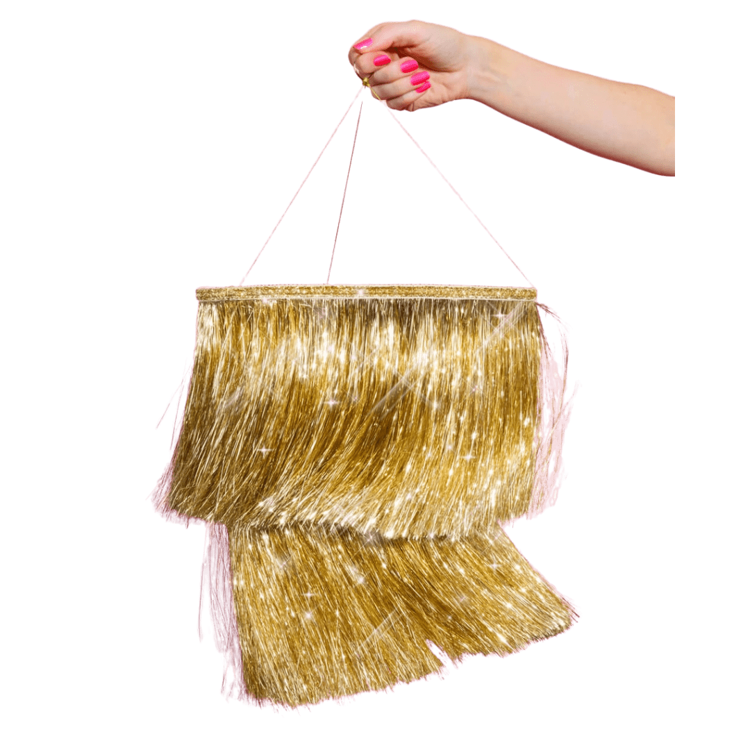 Gold fringe piñata with pink string for celebration from Parte Haus party supply store in Bethesda Maryland