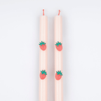 Pink taper candles with strawberry accents for summer celebration from Parte Haus party supply store in Bethesda Maryland