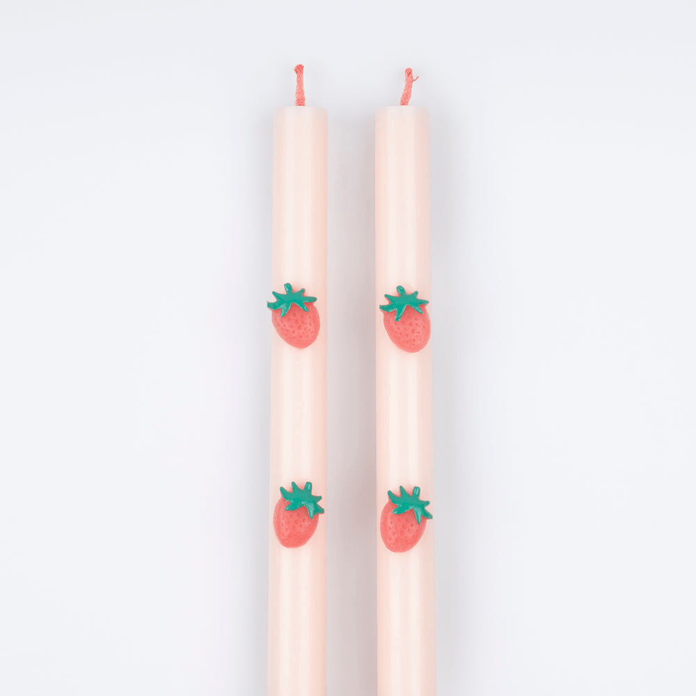 Pink taper candles with strawberry accents for summer celebration from Parte Haus party supply store in Bethesda Maryland