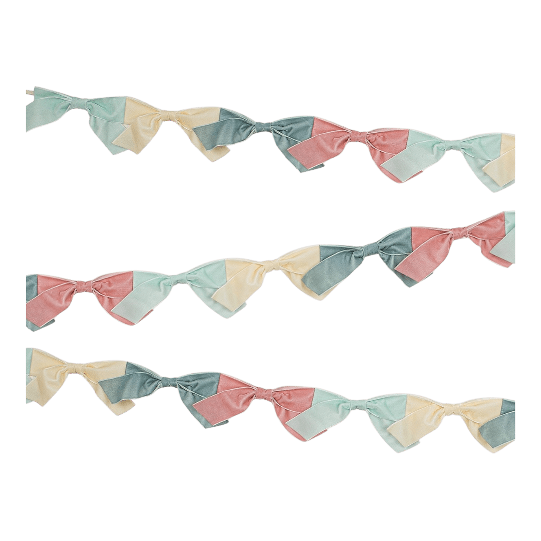 Pastel patchwork bow garland for birthday celebration from Parte Haus party supply store in Bethesda MD.
